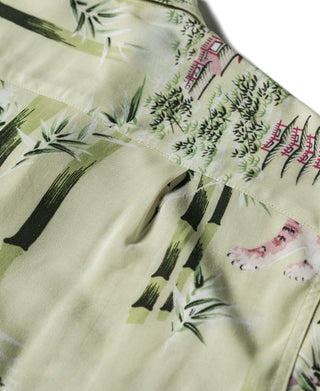 Light green aloha shirt with bamboo, palm leaves, and tiger graphics along front