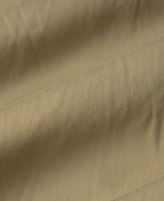 Brown bomber jacket lining panel with visible seam stitching