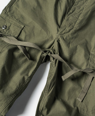 Olive fatigue pants with drawstring waist tie and front closure