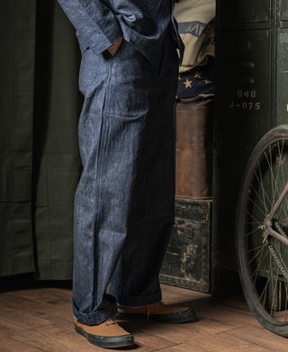 Indigo denim work trousers with button fly and straight leg silhouette