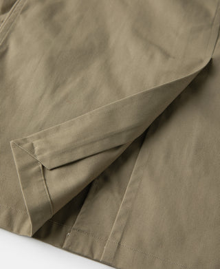 Khaki all-weather trench coat lower back vent and stitched flap