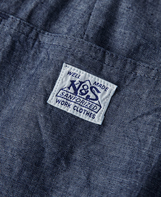 Indigo chambray pants fabric tag reading “Well made” and “Sanforized”