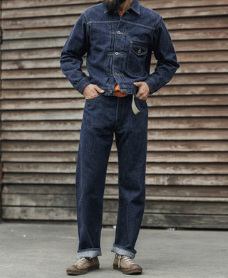Indigo denim jacket worn with matching jeans and tan work boots