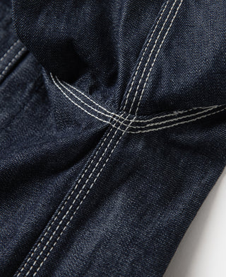 Indigo denim jacket seam and topstitching detail near cuff