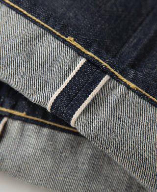 Indigo selvedge denim interior seam with striped selvedge tape detail