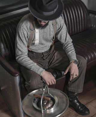 Gray heather henley with white button placket, shown seated