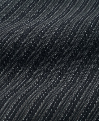 Close-up of black and gray pinstripe pattern on pants fabric
