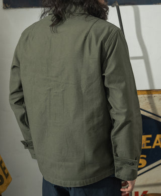 Olive fatigue utility shirt, back view with yoke and seam lines