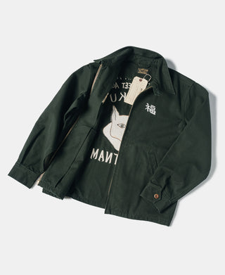 Dark green souvenir jacket with stand collar, front zipper, and embroidered chest graphic