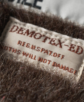 Navy deck jacket interior label text with "DEPARTMENT-ED" and size details