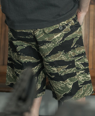 Camo cargo shorts with flap pocket and metal button closure