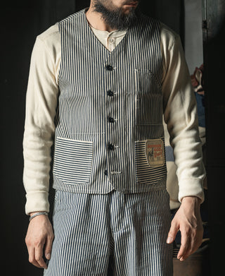 Men's pinstripe vest worn over a shirt, button front with patch pockets