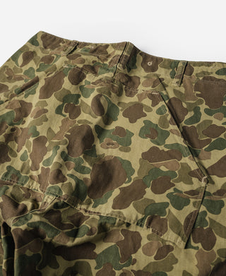 Camouflage cotton pants with straight leg, button closure, and pleated front waistband.