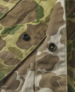 Camouflage duck hunter camo jacket, metal snap cuffs and collar details