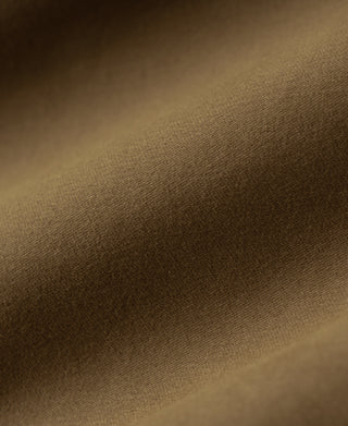 Brown moleskin fabric texture close-up on bomber jacket