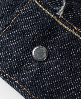 Indigo denim jacket button on dark denim with orange topstitching