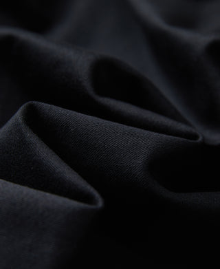 Black western shirt fabric close-up with smooth twill texture