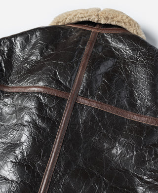 Dark brown leather flight jacket with cream shearling-lined hooded collar