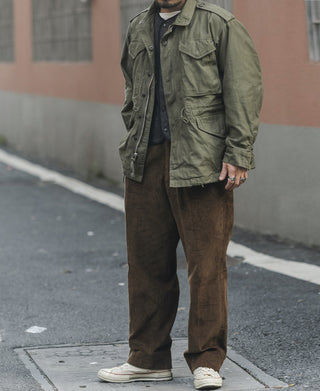 Olive field jacket with button flap chest pockets and drawstring waist
