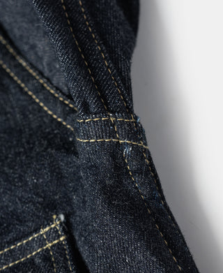 Indigo denim jacket pocket corner with yellow selvedge stitching