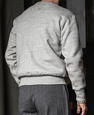 Back view of heather gray knit sweater with ribbed hem and long sleeves
