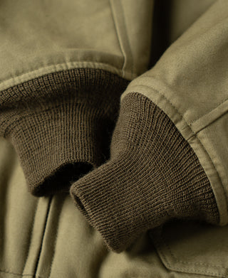 Khaki flight jacket ribbed knit cuff at sleeve with stitched hem