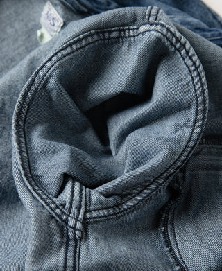 Stonewashed indigo denim work jacket neckline with zip placket and dark lining