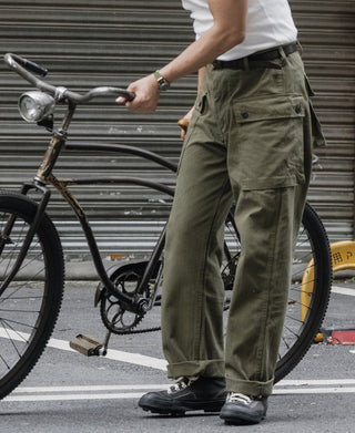 Olive utility cargo pants with front pockets and relaxed straight-leg fit