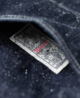 Indigo denim carpenter pants woven care label tag inside waistband