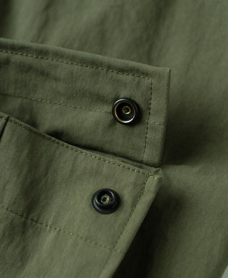 Olive shell arctic trousers, flap pocket with two metal-look buttons