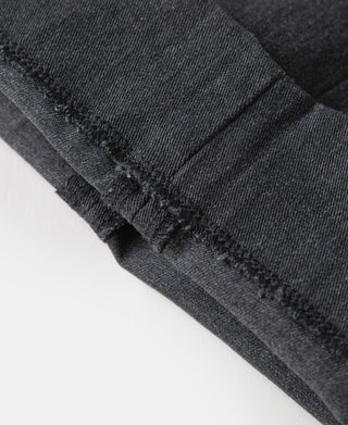 Dark gray chino trousers with textured stitching at the hem fold