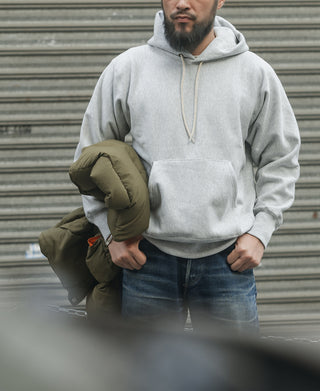 Gray pullover hoodie with adjustable hood drawstrings and kangaroo pocket