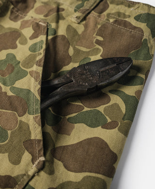 Camouflage cotton pants, drawstring and inner waistband tab detail with fabric stitching.