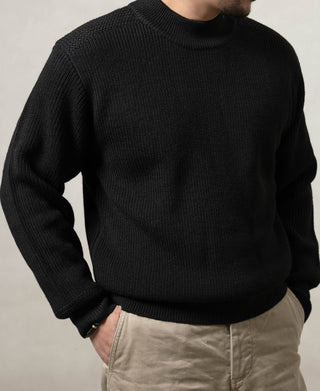 Black wool crewneck sweater worn on model, textured knit front