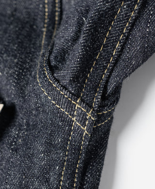 Indigo selvedge denim jacket sleeve seam with contrast yellow stitching