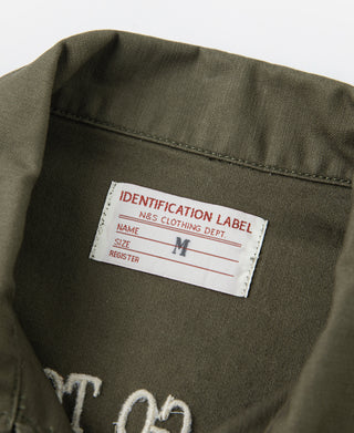 Olive vintage U.S. Army counselor shirt inner identification label, size M