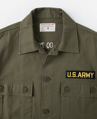 Olive vintage U.S. Army counselor shirt close-up with collar label and chest patch detail
