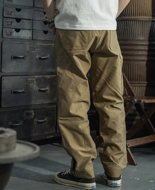 Khaki deck pants with large flap cargo pocket and stitched leg seams