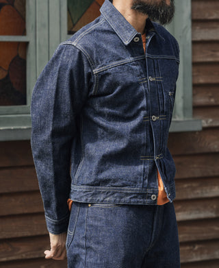Indigo denim jacket side view with button placket and flap pocket