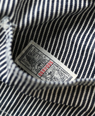 Striped carpenter pants interior care label stitched into the waistband