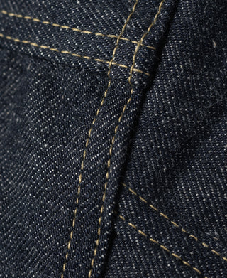 Indigo selvedge denim jacket, side seam with long vertical yellow stitching