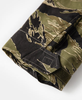 Camo tiger-stripe M-65 jacket shoulder detail with button placket and stitched seam