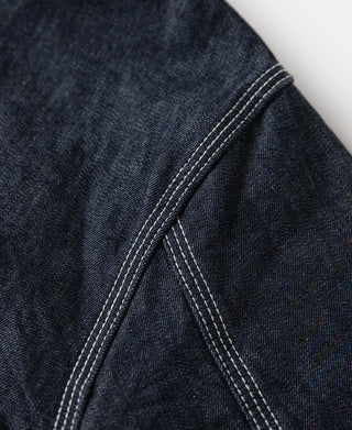 Indigo denim jacket side seam with double rows of topstitching