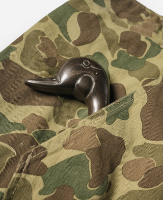 Camouflage cotton pants, button at waistband with dark snap hardware and stitched placket.
