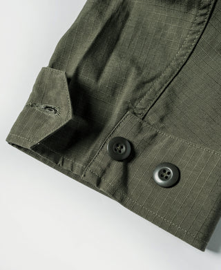 Olive fatigue jacket sleeve cuff with button and adjustable tab