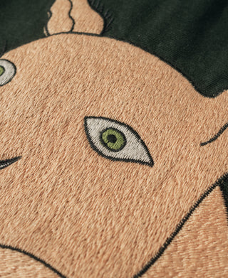 Fox head embroidery on dark green jacket with green eye detail