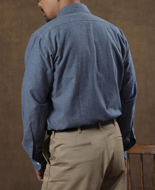 Blue chambray work shirt back view with yoke and buttoned cuffs