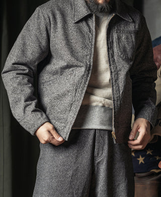 Salt-and-pepper cossack jacket with zip front, stand collar, and hip pocket