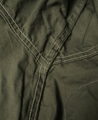 Olive jacket stitched seam with reinforced corner stitching