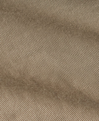 Khaki woven jacket fabric close-up with fine texture